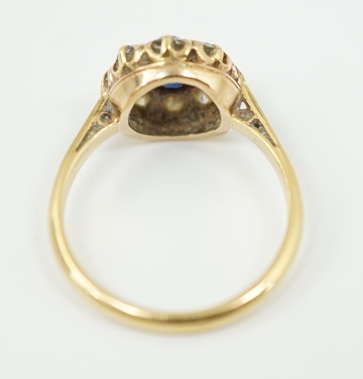 An 18ct gold, sapphire and diamond cluster ring